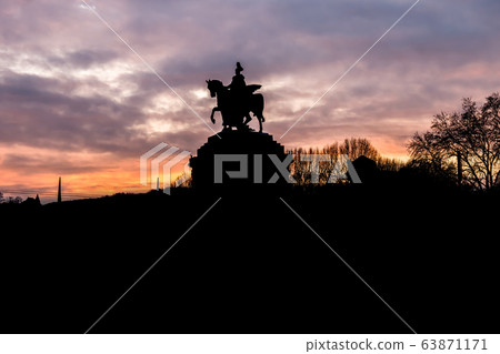 Colorful Sunrise burning sky Koblenz City historic monument German Corner where river rhine and mosele flow together 63871171