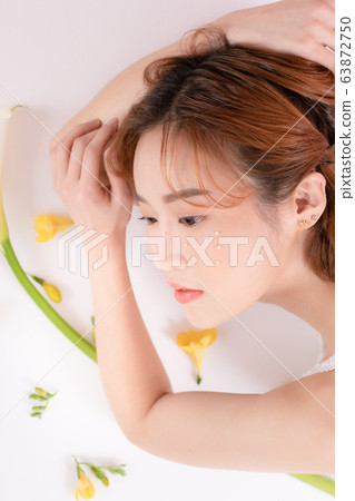 Woman beauty flowers 63872750