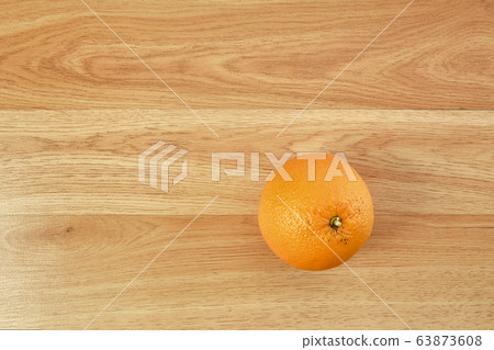Fresh orange fruit on wooden table Fresh orange fruit on wooden table 63873608
