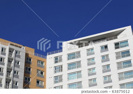 Beautiful scenery with blue sky and apartments Beautiful scenery with blue sky and apartments 63875012