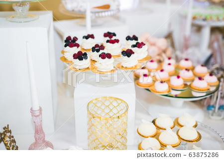 Delicious wedding reception candy bar dessert table Delicious wedding reception candy bar dessert table 63875286
