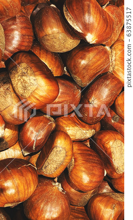 Ripe chestnuts close up, top view. Food background Ripe chestnuts close up, top view. Food background 63875517