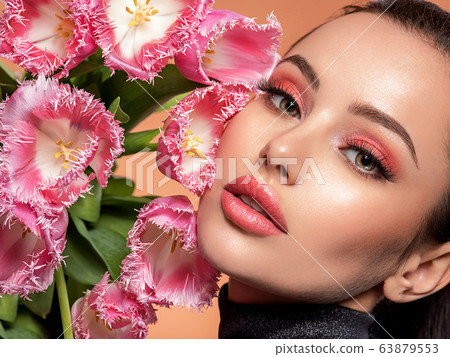 Beautiful white girl with flowers. Stunning Beautiful white girl with flowers. Stunning 63879553