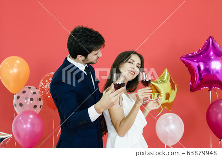 Young couple celebrating new year together. Young couple celebrating new year together. 63879948