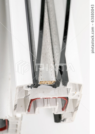 A cross section of wood effect Double glazing cut away to show the inner profile and construction quality A cross section of wood effect Double glazing cut away to show the inner profile and construction quality 63880843