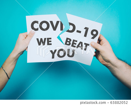 Female and male hands tear off a white sheet of 63882052