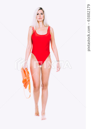 Lifeguard in red sexy swimsuit with lifeguard rescue can floating buoy 63882179