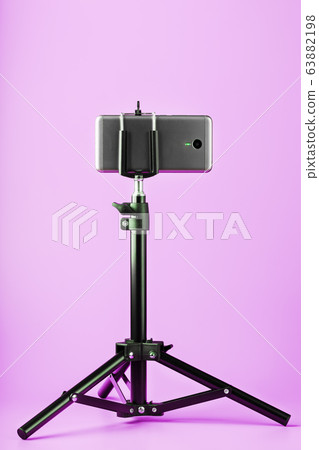 Smartphone on a tripod as a photo-video camera on 63882198