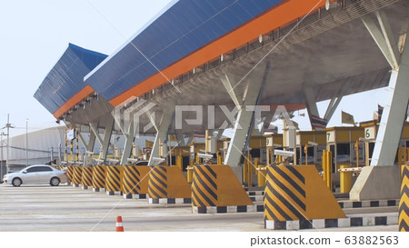 Antibacterial and antiviral treatment of toll roads in Thailand. Spraying chemical fluid over cars. Disinfection of vehicles roads. Pandemic covid-19. Antibacterial and antiviral treatment of toll roads in Thailand. Spraying chemical fluid over cars. Disinfection of vehicles roads. Pandemic covid-19. 63882563