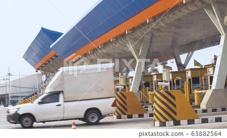 Antibacterial and antiviral treatment of toll roads in Thailand. Spraying chemical fluid over cars. Disinfection of vehicles roads. Pandemic covid-19. Antibacterial and antiviral treatment of toll roads in Thailand. Spraying chemical fluid over cars. Disinfection of vehicles roads. Pandemic covid-19. 63882564