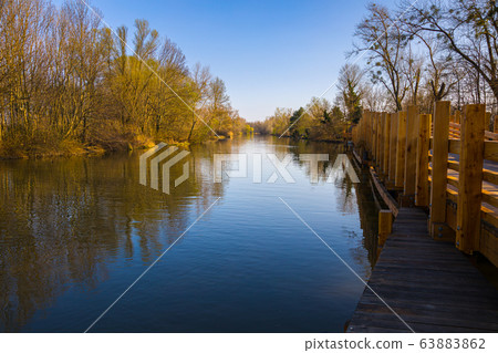 Small Danube river in spring time. Small Danube river in spring time. 63883862