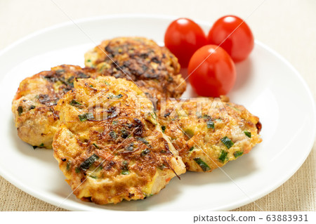 Chicken pickata. Served with mini tomatoes. Chicken pickata. Served with mini tomatoes. 63883931