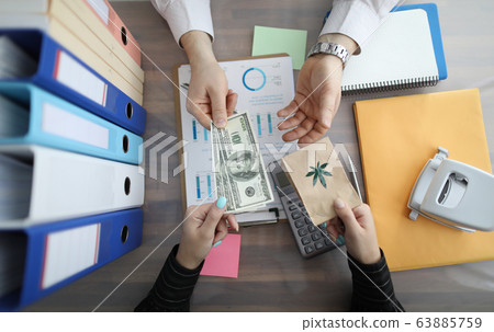 Woman buying marijuana 63885759