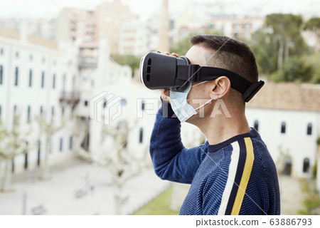 man using a virtual reality headset 63886793