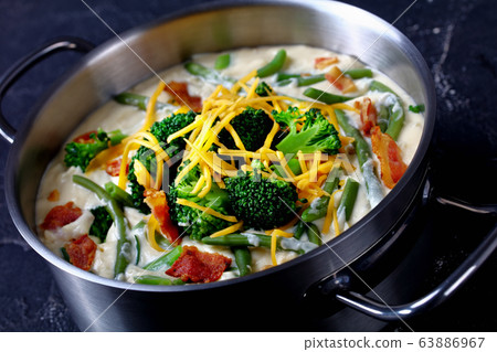 close-up of cream soup with broccoli, green bean close-up of cream soup with broccoli, green bean 63886967