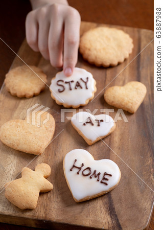Icing cookie written as STAY AT HOME Icing cookie written as STAY AT HOME 63887988