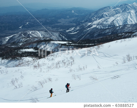 Mountain photographer shooting backcountry buddies Mountain photographer shooting backcountry buddies 63888527