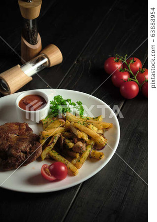 Meat medallion and french fries . catering menu Meat medallion and french fries . catering menu 63888954