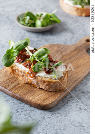 Sandwich on toast with fresh radish microgreens Sandwich on toast with fresh radish microgreens 63889262