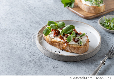 Sandwich on toast with fresh radish microgreens Sandwich on toast with fresh radish microgreens 63889265