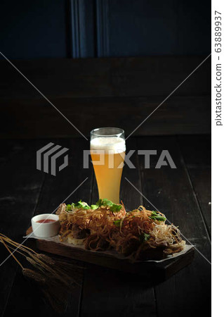 Glass of cold beer with appetizer. catering menu Glass of cold beer with appetizer. catering menu 63889937
