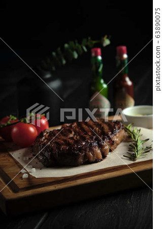 Meat steak on a wooden board. catering menu Meat steak on a wooden board. catering menu 63890075