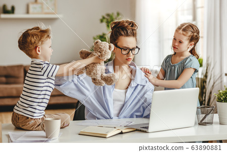 Little children distracting dedicated young woman Little children distracting dedicated young woman 63890881