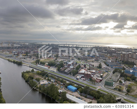 Drone view of the industrial part of St. Petersburg, Kanonersky island with Western high-speed diameter 63891314