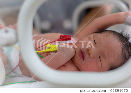 Newborn newborn incubator working hard with incubator 63891670
