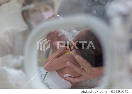 Newborn newborn incubator working hard with incubator 63891671