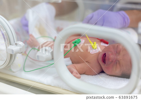 Newborn newborn incubator working hard with incubator 63891675
