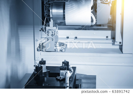 The robotic arm system working with  the CNC machine. 63891742