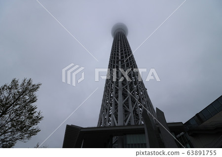 Tokyo Sky Tree with the upper part disappearing in a cloudy sky Tokyo Sky Tree with the upper part disappearing in a cloudy sky 63891755