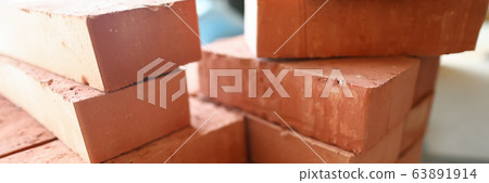 Building materials are on floor, stack red bricks Building materials are on floor, stack red bricks 63891914