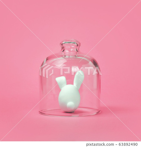 Quarantined Easter, holiday is canceled Creative idea COVID-19 virus pandemic coronavirus Easter bunny isolated 63892490