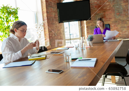 Business young caucasian woman in modern office with team Business young caucasian woman in modern office with team 63892758