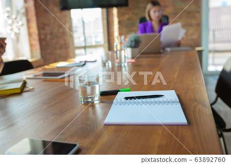 Young caucasian business woman working in office, diversity and girl power concept Young caucasian business woman working in office, diversity and girl power concept 63892760