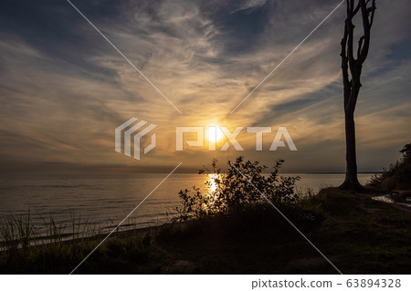 Sunset on the Baltic Sea coast in Nienhagen, 63894328