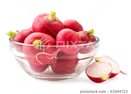 Radish in a glass plate on a white background. Radish in a glass plate on a white background. 63894722