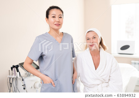 Mature woman visiting her cosmetologist Mature woman visiting her cosmetologist 63894932