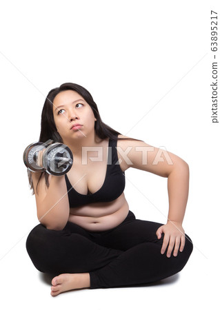 lazy fat woman bored face tired exhausted to exercise hand lift dumbbell weight loss concept lazy fat woman bored face tired exhausted to exercise hand lift dumbbell weight loss concept 63895217
