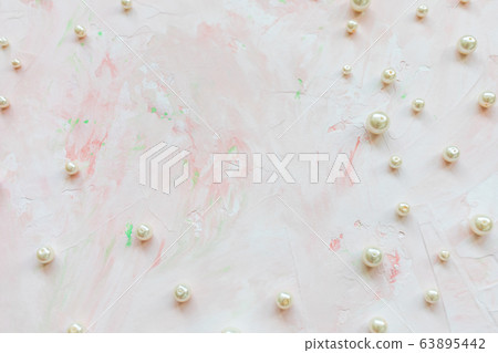 White pearls on pink. Creative abstract background 63895442