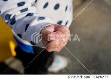 Children hold hands strongly Children hold hands strongly 63896463