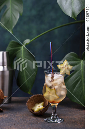 Tropical cocktail with carambola Tropical cocktail with carambola 63897504