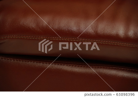 Dark Brown leather sofa, close up detail. Furniture showroom photography Dark Brown leather sofa, close up detail. Furniture showroom photography 63898396