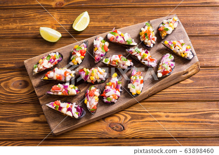 Traditional Peruvian food background with mussels Traditional Peruvian food background with mussels 63898460