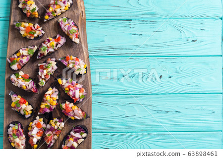 Traditional  Peruvian food background with mussels 63898461