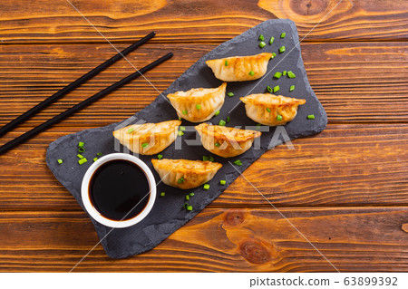 Traditional asian dumplings gyoza Traditional asian dumplings gyoza 63899392
