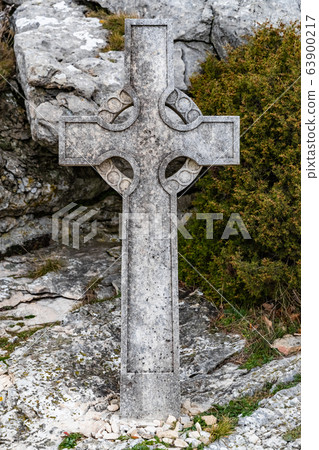 The sacred cross St.Pilon is on the mountain in cloudy weather, clouds over a valley, a dry grass, mountain over grotto of Mary Magdalene The sacred cross St.Pilon is on the mountain in cloudy weather, clouds over a valley, a dry grass, mountain over grotto of Mary Magdalene 63900217