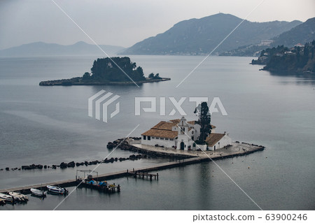Monastery Vlacherna and the Mouse Island at clouds rainy weather, sea gulf, the airport runway is nearby, Kanoni, Corfu, Greece 63900246